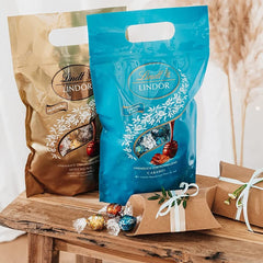 Boules de chocolat LINDOR au caramel salé | env. 80 boules de chocolat au lait fourrées au caramel salé | Pack Vrac & Boules de Chocolat Marc de Champagne | 700g