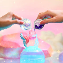 Mdr Surprise ! Mermaids Makeover Magic Tots - Véritable brillant à lèvres pour vous et votre poupée à fabriquer vous-même, mélanger et créer du maquillage, jeu d'eau amusant, 6 poupées à collectionner - 4 ans et plus