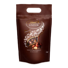 Boules de chocolat LINDOR aux noisettes, sac de 1 kg + fût Johnnie Walker Sherry 0,7 litre