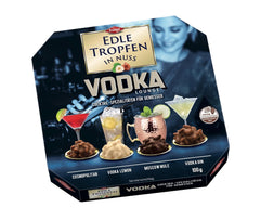 Edle Tropfen in Nuss Vodka Lounge 100g, pralines au chocolat remplies de liquide avec glaçage au chocolat au lait et morceaux croquants de noisette