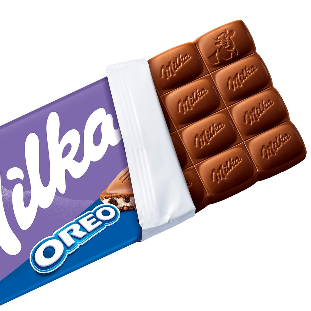 Milka Oreo – Chocolat au lait alpin fourré de morceaux croquants de biscuits Oreo et de crème onctueuse à la vanille – 100g