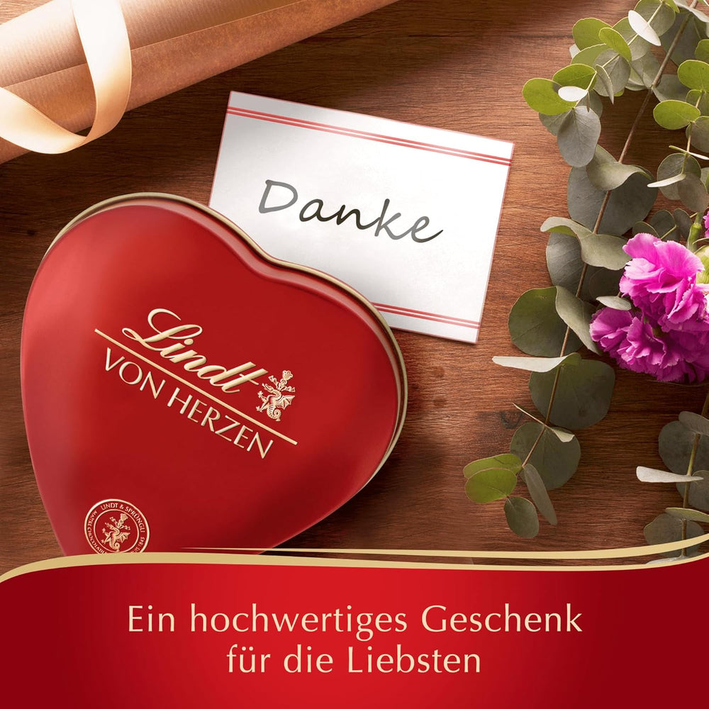 Chocolat Lindt du cœur | 30g | 6 pralines au Marc de Champagne, Coeur à l'Orange, Croustillant de Chocolat au Lait, Massepain Orange dans une jolie boîte en forme de coeur | Cadeau de chocolat | Cadeau chocolat