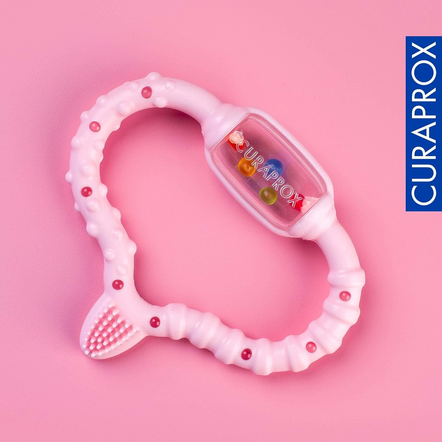 Curaprox Anneau de dentition pour bébé – Pour les tout-petits de 0 à 24 mois/soulage les maux de dents et favorise la motricité | Sans BPA, rose, avec brosse à dents d'entraînement/fabriqué en Suisse