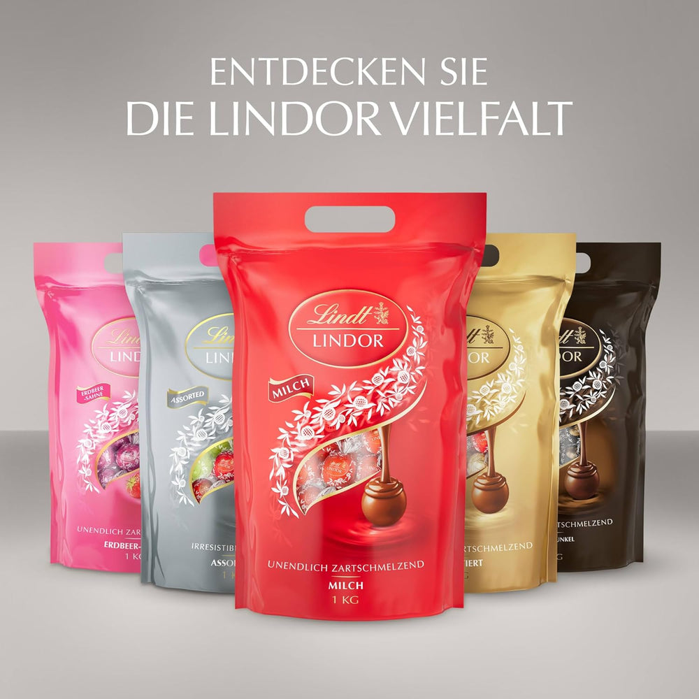 Chocolat Lindt | Sac assorti LINDOR argent | Sac de 1 kg | 80 boules de chocolat au lait fondantes, 70%, arômes caramel au beurre salé et double chocolat | Cadeau de chocolat à partager